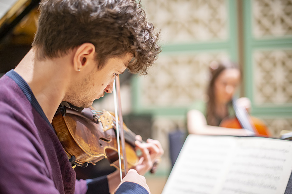 Violinist rehearsing in the RCM's new performance hall